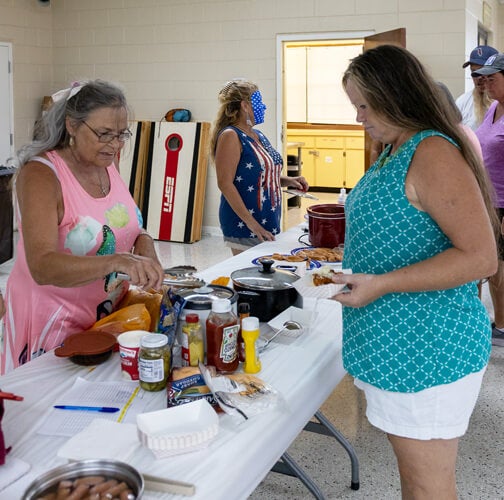 Guests serving food at a special event at Holiday RV Park in Leesburg, Florida.