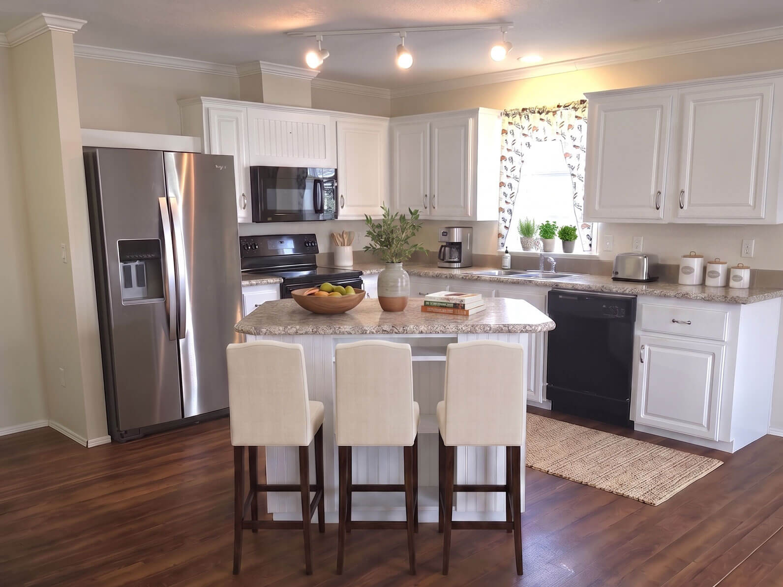 Virtually staged kitchen inside a home for sale at Lake Griffin Harbor Village in Florida.