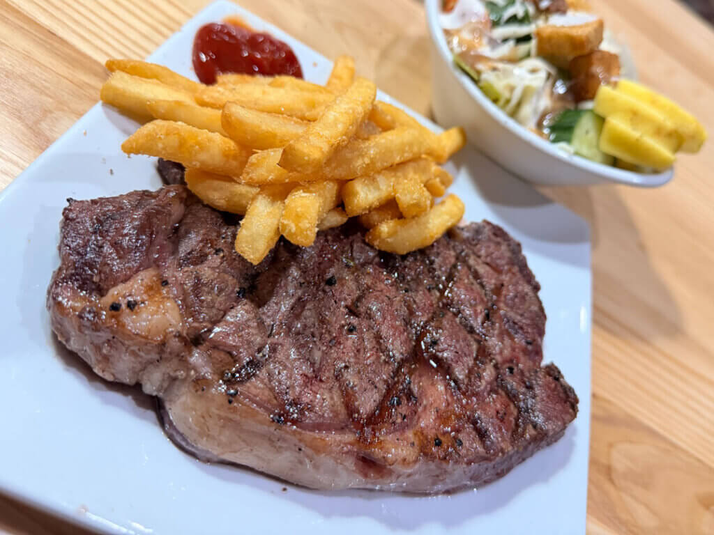 Steak and french fries with a salad at the Big Cypress Grill