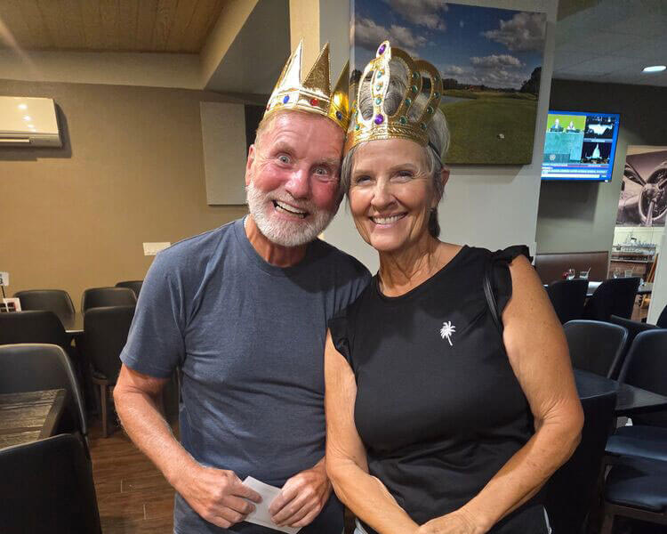 A man and woman wearing the trivia crowns at Big Cypress Grill.