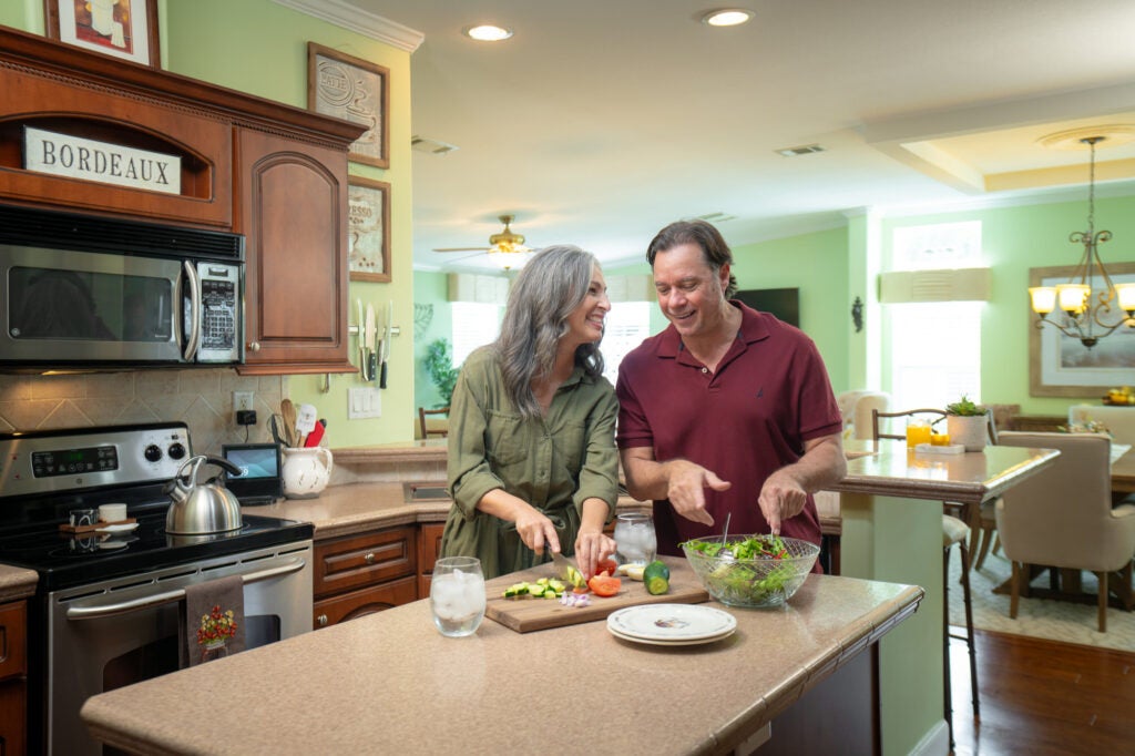 Couple cooking in kitchen