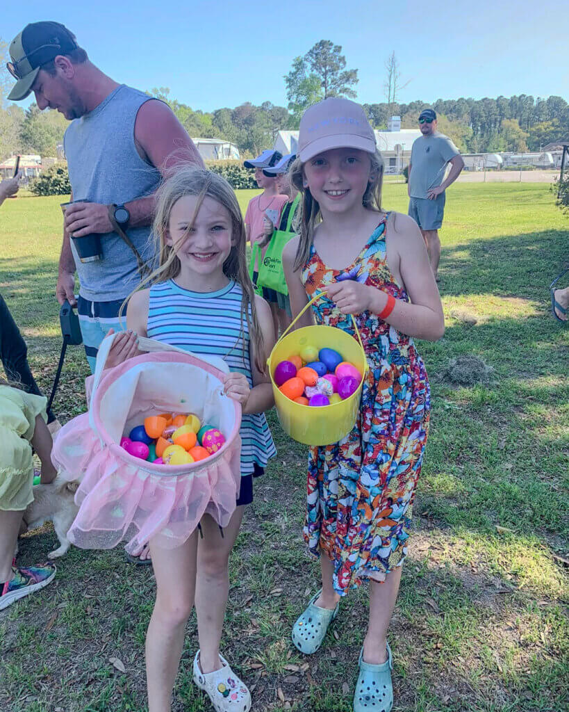 Guests at CreekFire RV holding Easter Baskets during the Easter Egg Hunt for Themed Weekends.