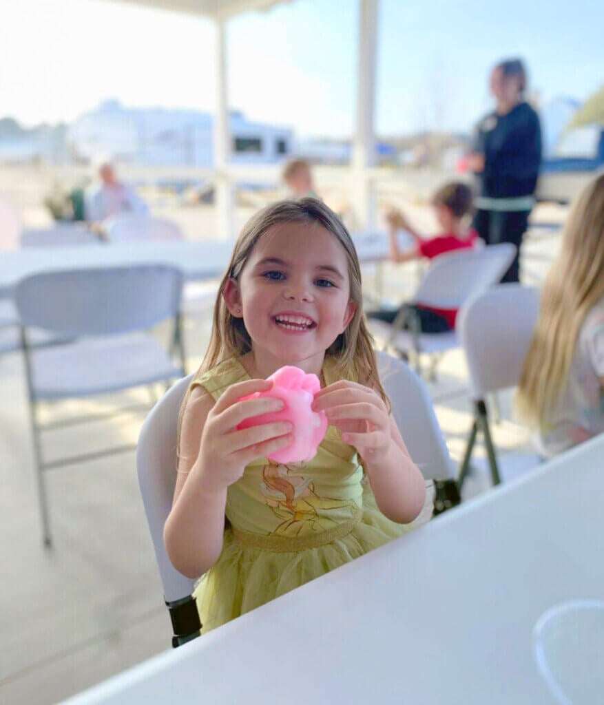 Young girl making slime craft at CreekFire RV Resort in Savannah, GA.