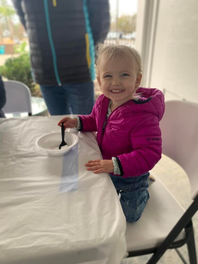Child playing with instant snow craft at CreekFire RV Resort
