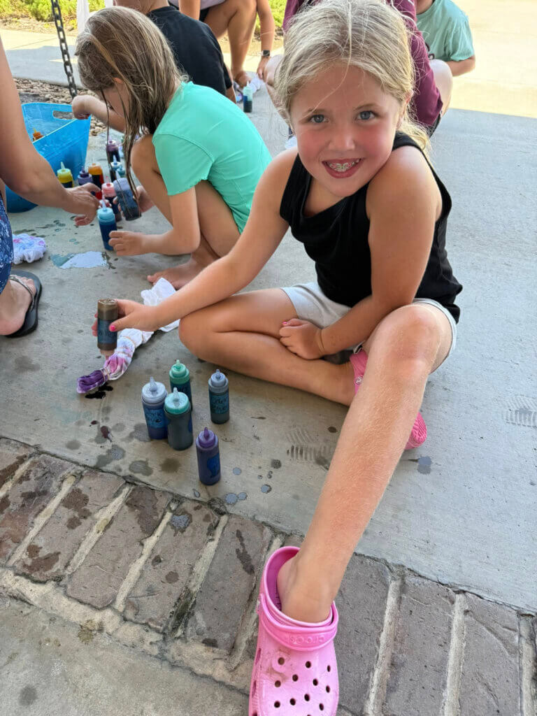Young girl doing tie dye activity at CreekFire RV Resort