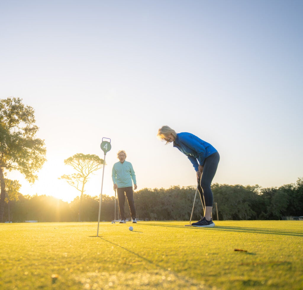 Couple Putting on Golf Course