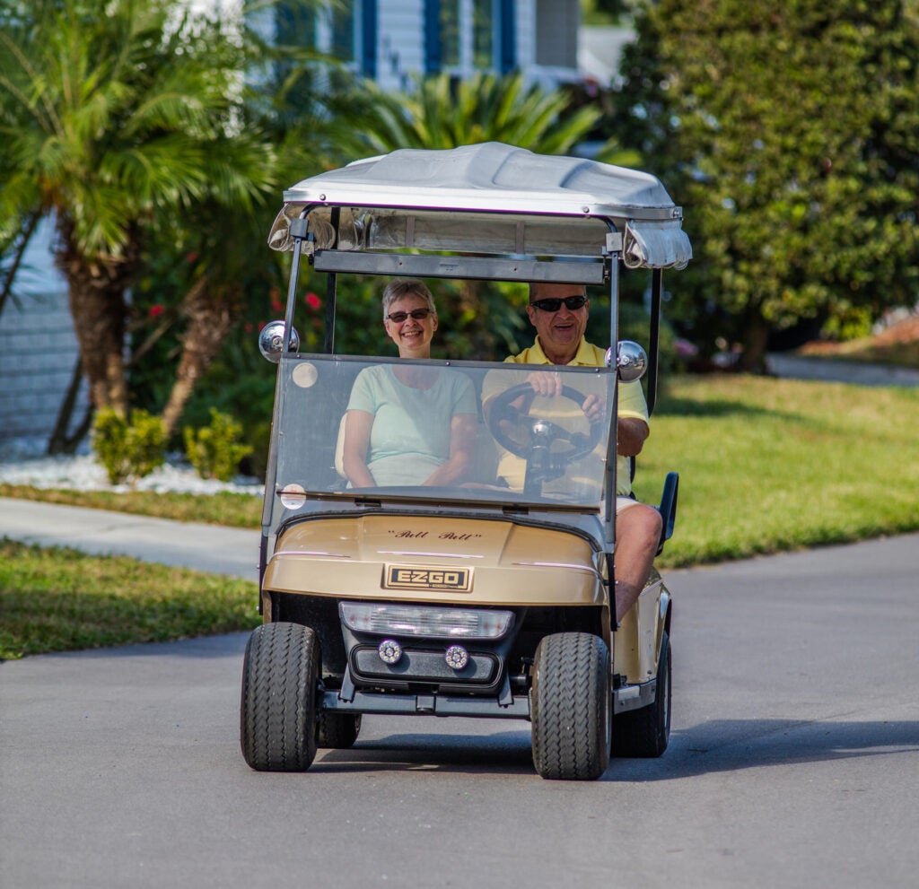 couple in golf cart