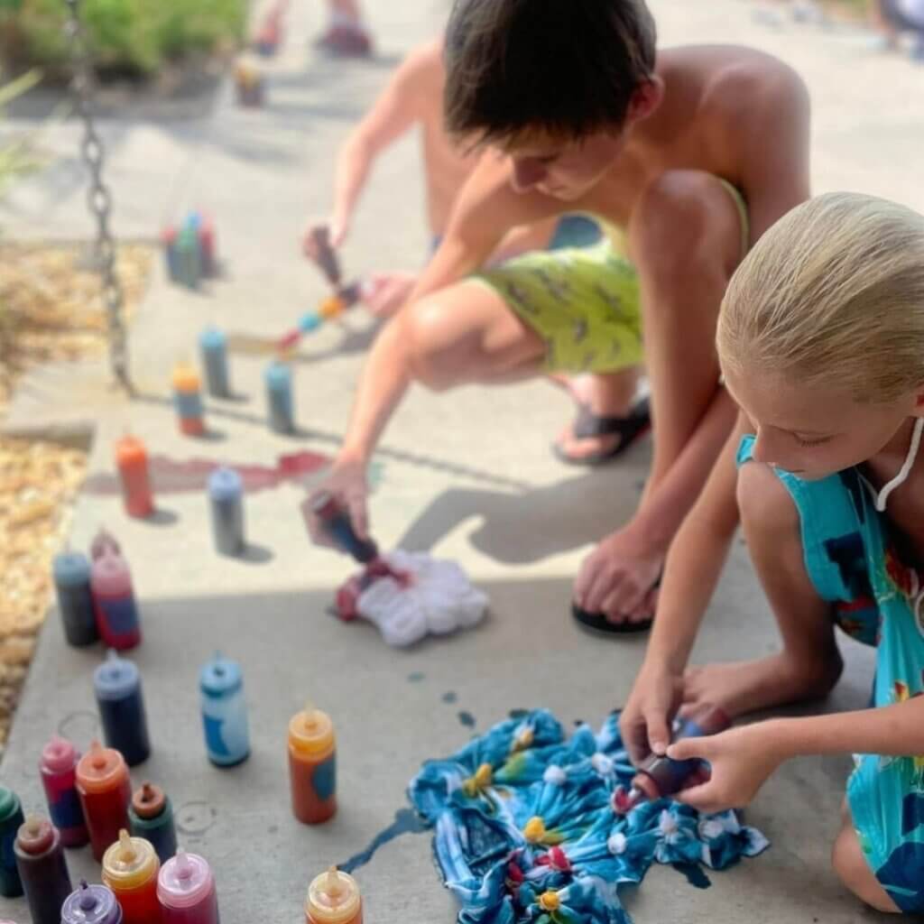 Kids creating tie dye shirts at CreekFire RV Resort in Savannah, Georgia.