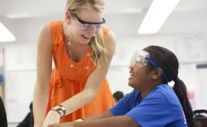 Teacher Helping Student