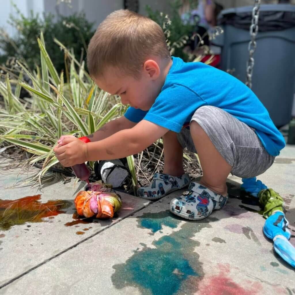 Kids creating tie dye shirts at CreekFire RV Resort in Savannah, GA