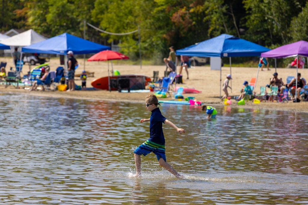 Point Sebago Resort boy running into lake