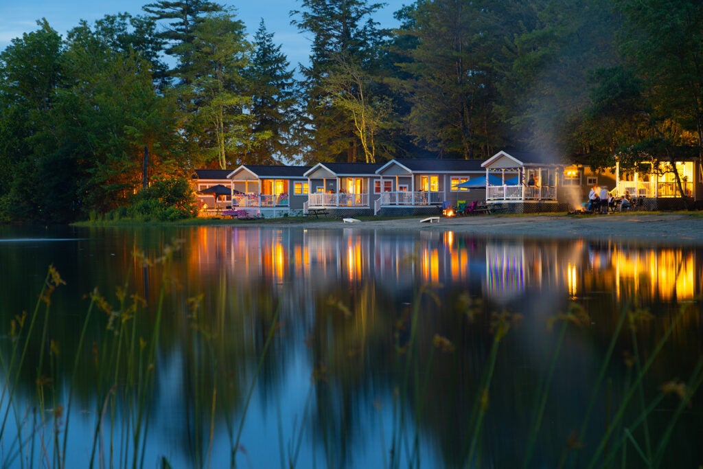 Cabin along lake at dusk at Point Sebago