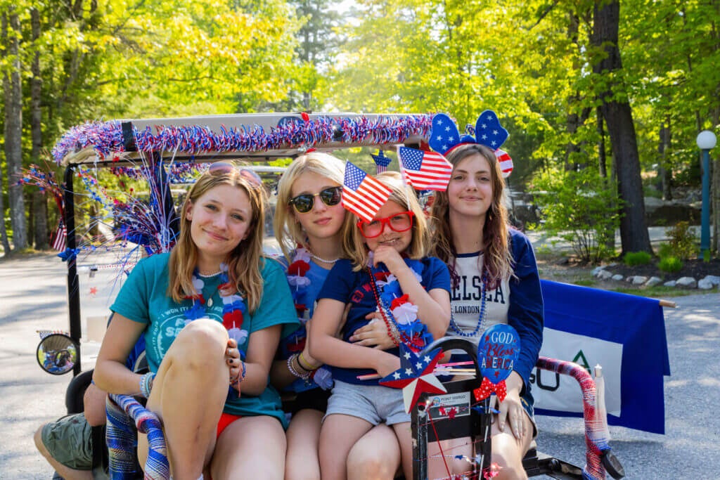 family in decorated golf cart