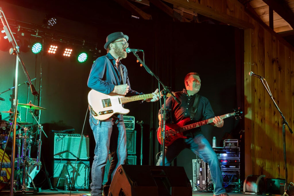 Guitarist and lead singer performing on stage