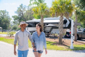 Couple walking through Lake Jasper RV Park in South Carolina.