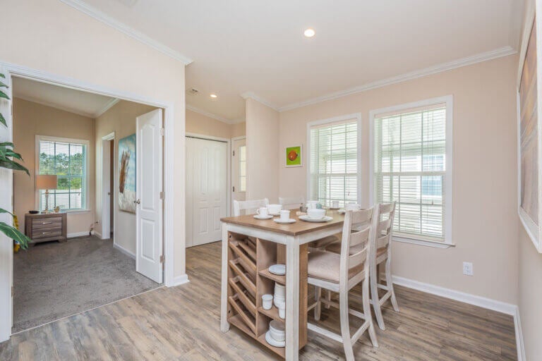 Staged dining area in a manufactured home at The Meadows.