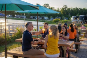 Friends grabbing drinks at the CreekFire RV Resort restaurant.