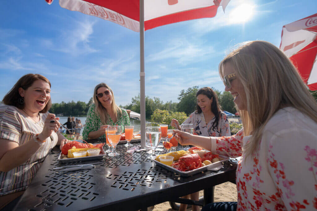 Point-Sebago_Lobster_Dinner-Food Friend enjoying a lobster lunch at Point Sebago Resort in Maine.