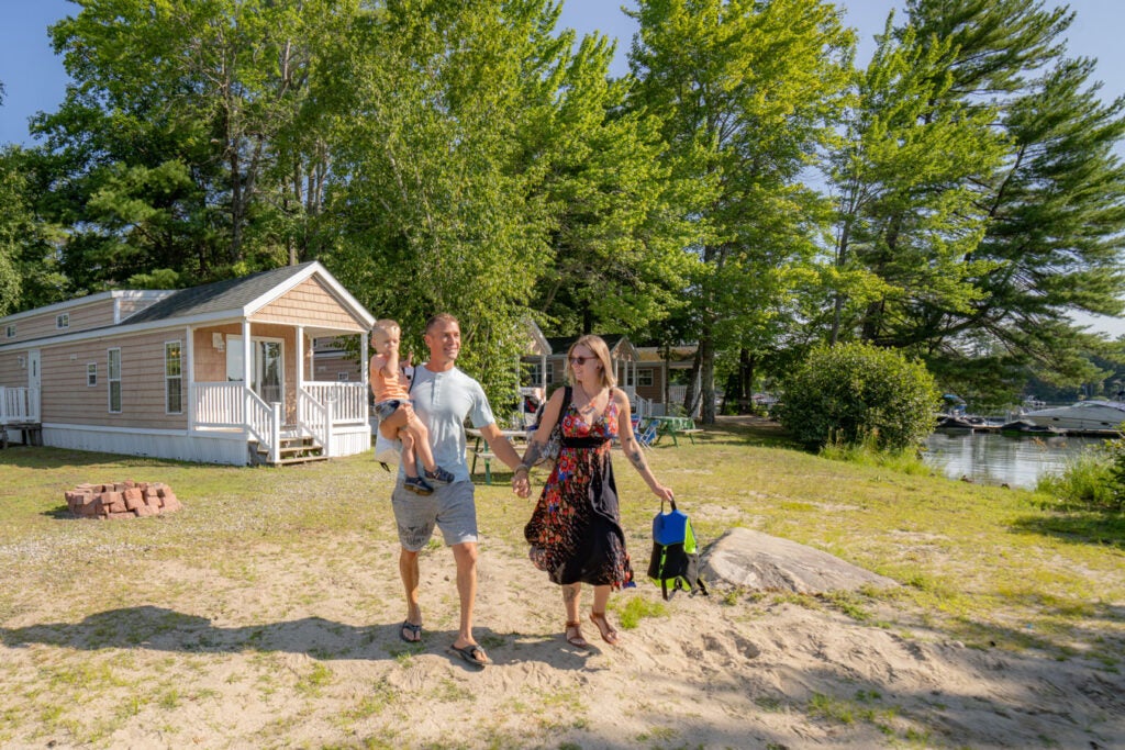 Joey Fitts and Miranda Jackson leaving a cabin at Point Sebago Resort in Casco, Maine.