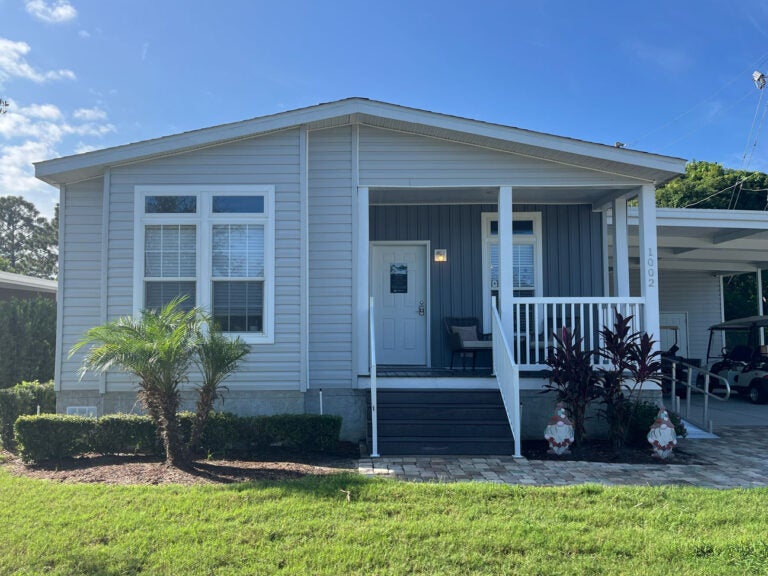 A 55+ manufactured home with a water view at Meadowlea Village in DeLand, Florida.