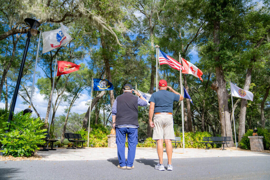 Veterans saluting at military plaza at Rolling Greens Village in Ocala, Florida.