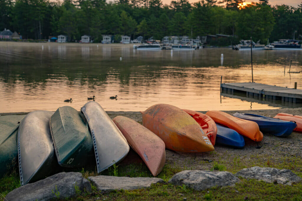 Canoes along Sebago Lake at Point Sebago Resort in Maine.