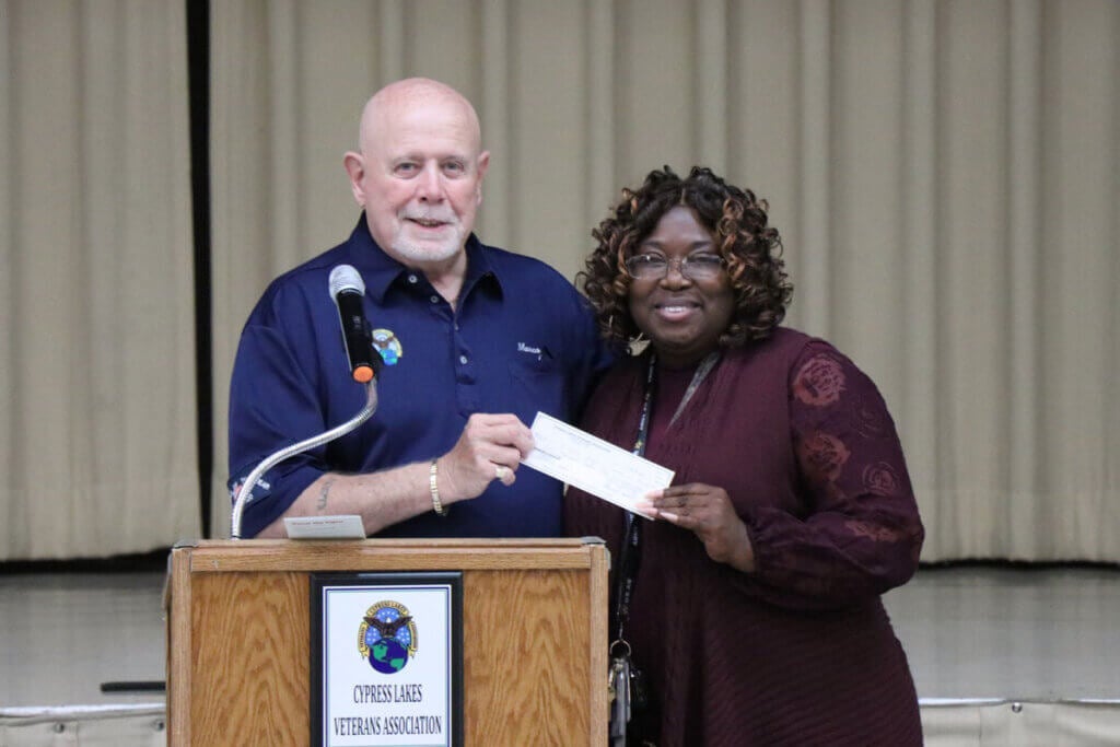 The Cypress Lakes Veterans Association donates a check during a meeting in Lakeland, Florida.