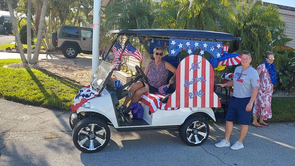 Veterans Day golf cart parade at Jamaica Bay Village a 55+ retirement community in Florida.