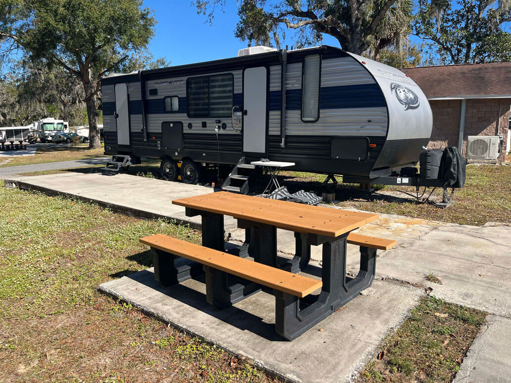 RV site and picnic table at Holiday RV Park in Florida.