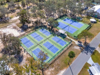 aerial views of Tennis courts and pickleball courts available at Holiday RV Park in Leesburg, Florida.