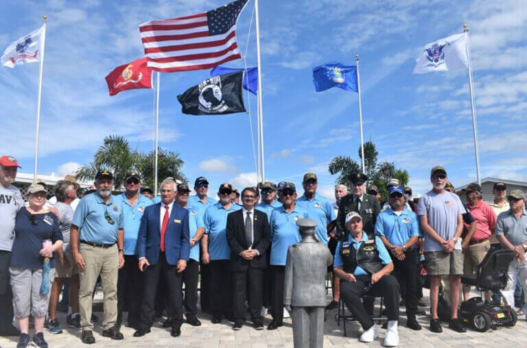 Veterans standing at veteran park in The Meadows, a 55+ community in Tarpon Springs, Florida.