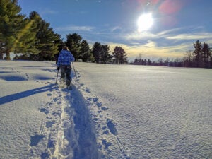 Snowshoeing on a sunny day in Maine