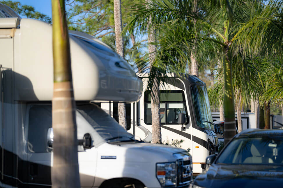 RVs lined up at RV sites in Fort Myers, Florida at Blueway RV Park.