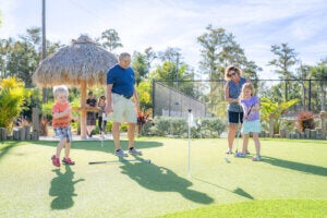Family playing miniature golf at Blueway RV Park in Fort Myers, Florida.
