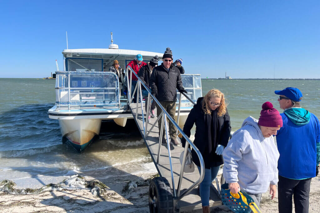 Sun Valley residents disembarking at Anclote Key, Florida.