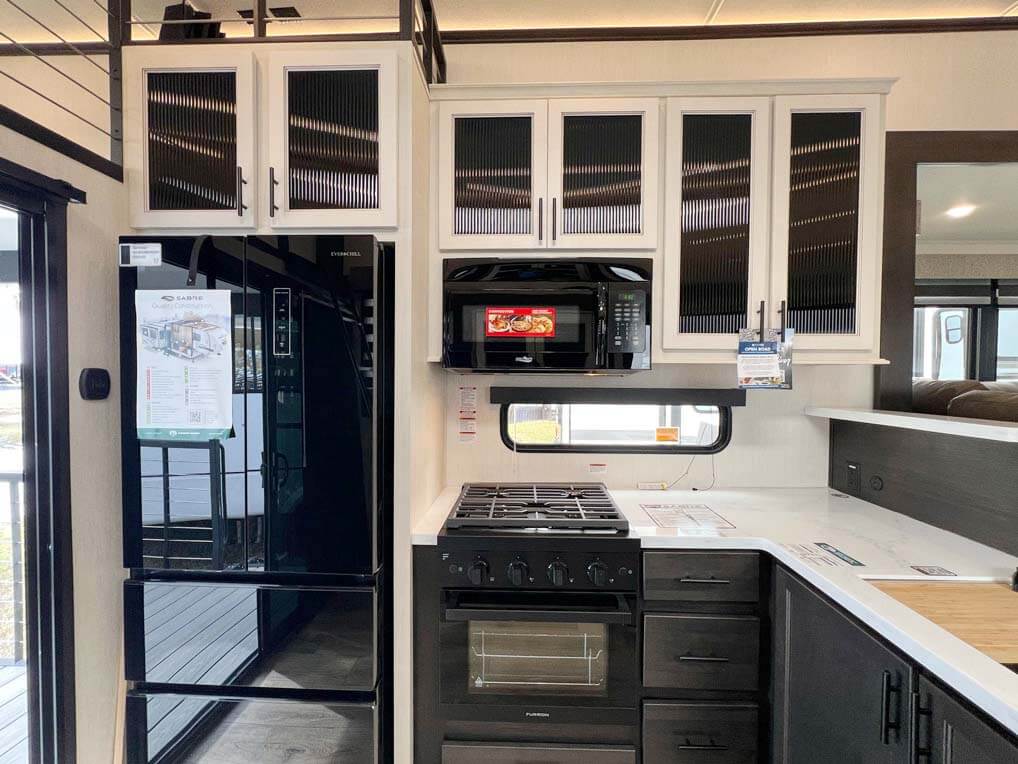 Kitchen inside the Sabre travel trailer at the RV SuperShow in Tampa.