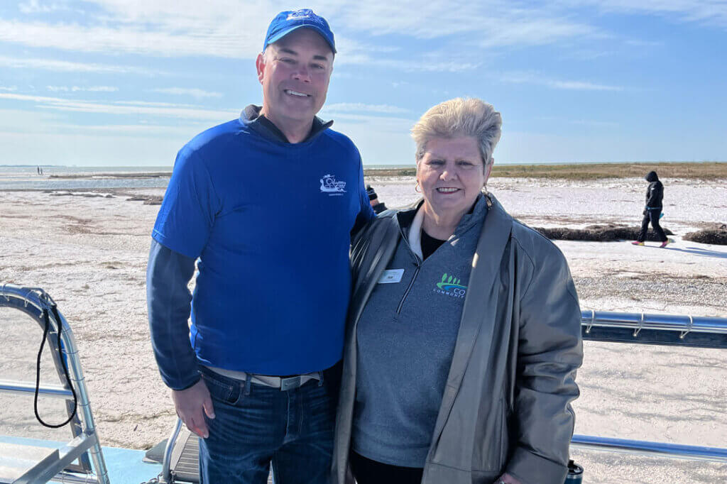 Odyssey Cruise team and Cove Communities staff on Anclote Key Beach, Florida