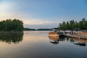 Sunrise on Sebago Lake with a view from the marina at Point Sebago Resort.