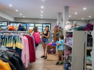 Family shopping at the General Store in Point Sebago Resort.