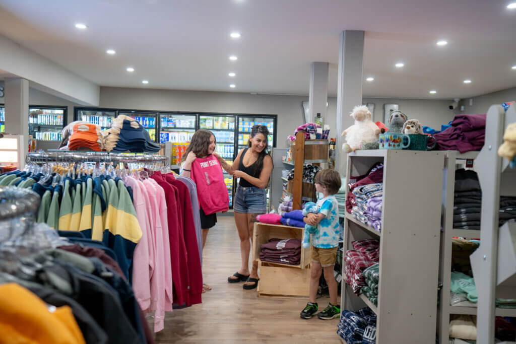 Family shopping at the General Store in Point Sebago Resort.