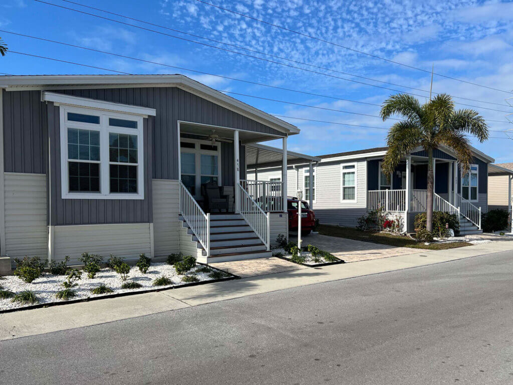 Two manufactured homes sitting side-by-side in Tarpon Springs, Florida in The Meadows.