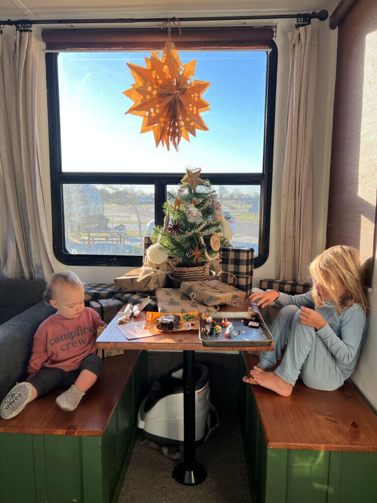 Kids decorating for Christmas in the RV.