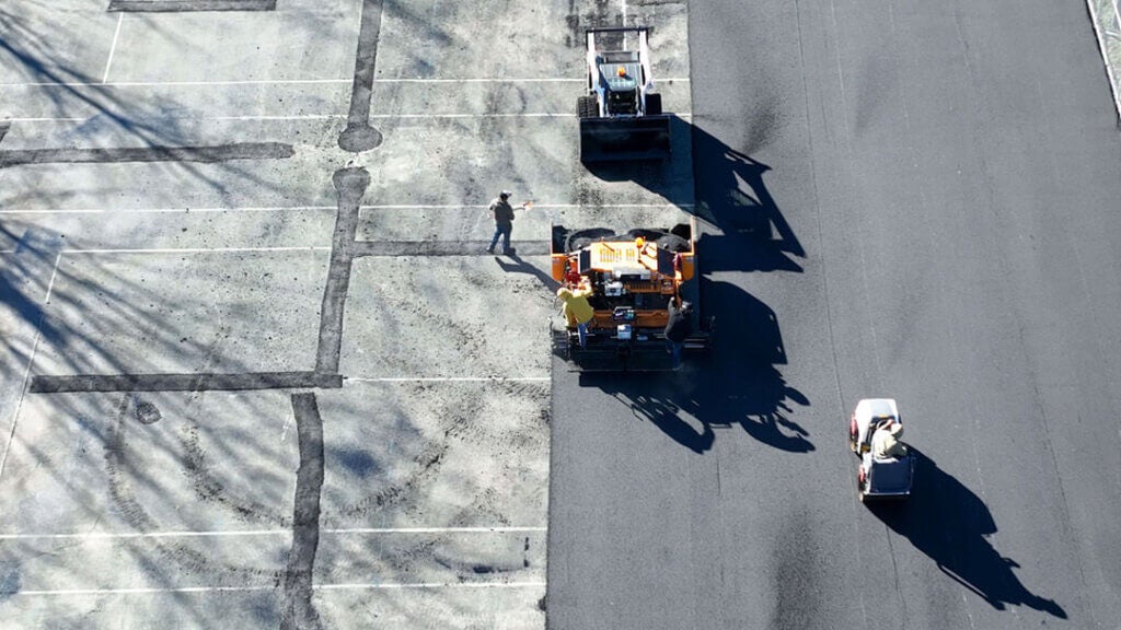 Team resurfacing the sports courts at Point Sebago Resort in November 2024 in Casco, Maine.