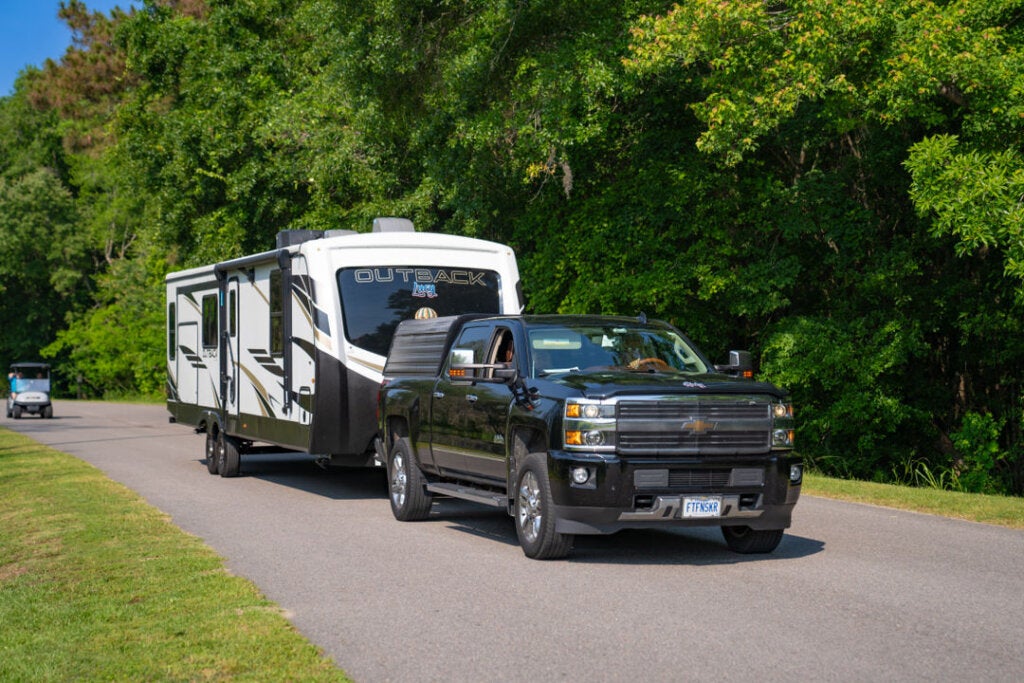 Chevy truck hauling an Outback fifth wheel at CreekFire RV Resort in Savannah, GA.
