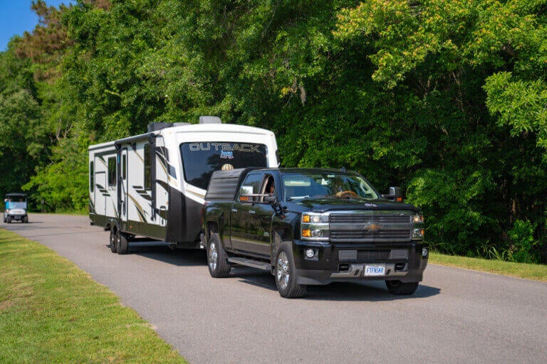 Chevy truck hauling an Outback fifth wheel at CreekFire RV Resort in Savannah, GA.