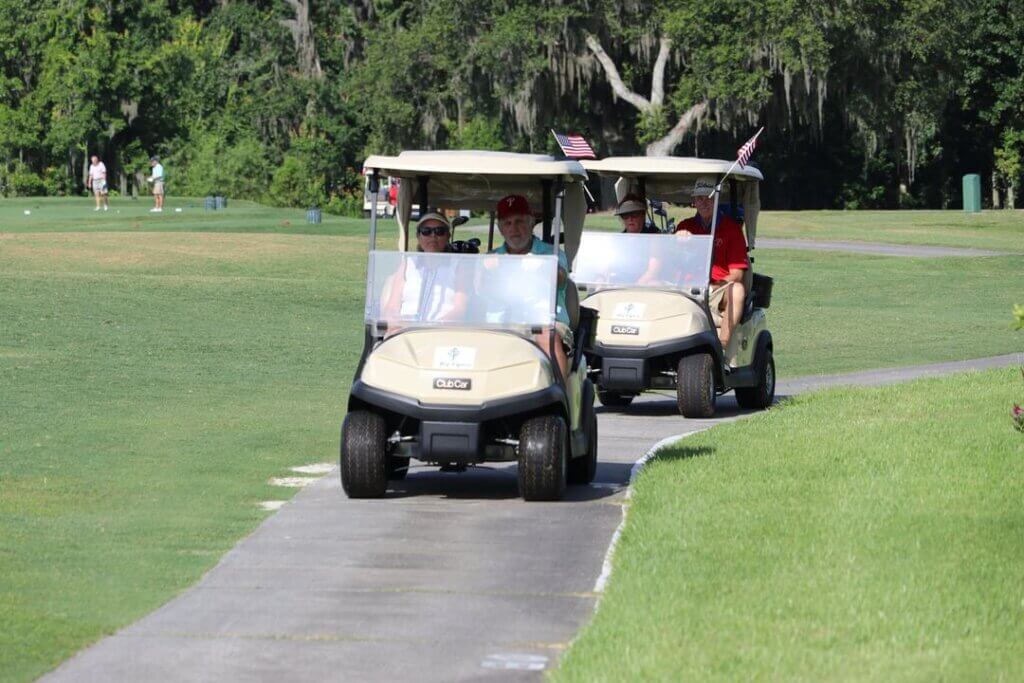 Two golf carts driving down the path at Big Cypress Golf Club in Lakeland, Florida.