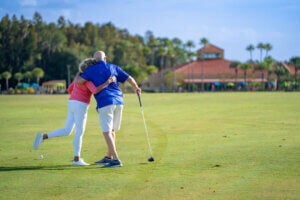 Couple hugging on the Big Cypress Golf Club in Lakeland, Florida.