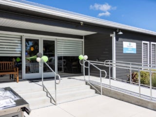Exterior view of fully renovated West Clubhouse at Rolling Greens Village in Ocala, Florida.