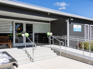 Exterior view of fully renovated West Clubhouse at Rolling Greens Village in Ocala, Florida.