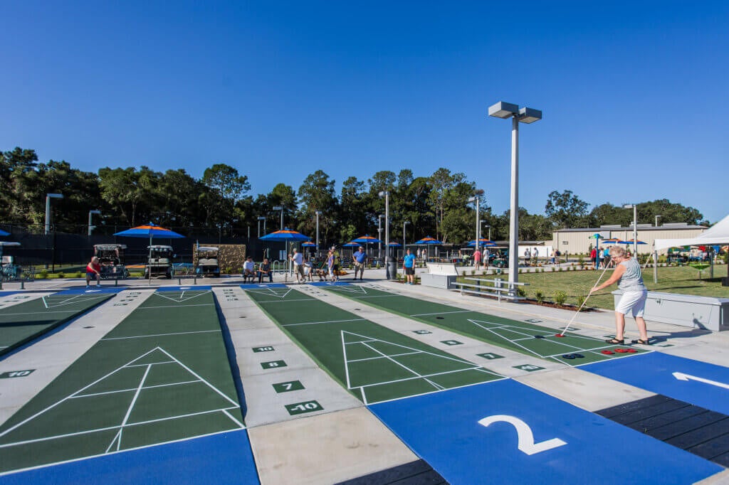 residents playing shuffleboard at the Rolling Greens Shuffleboard Courts